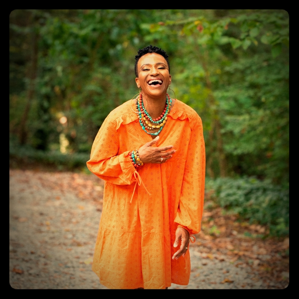 Orange bell sleeve dress with  eyelet details